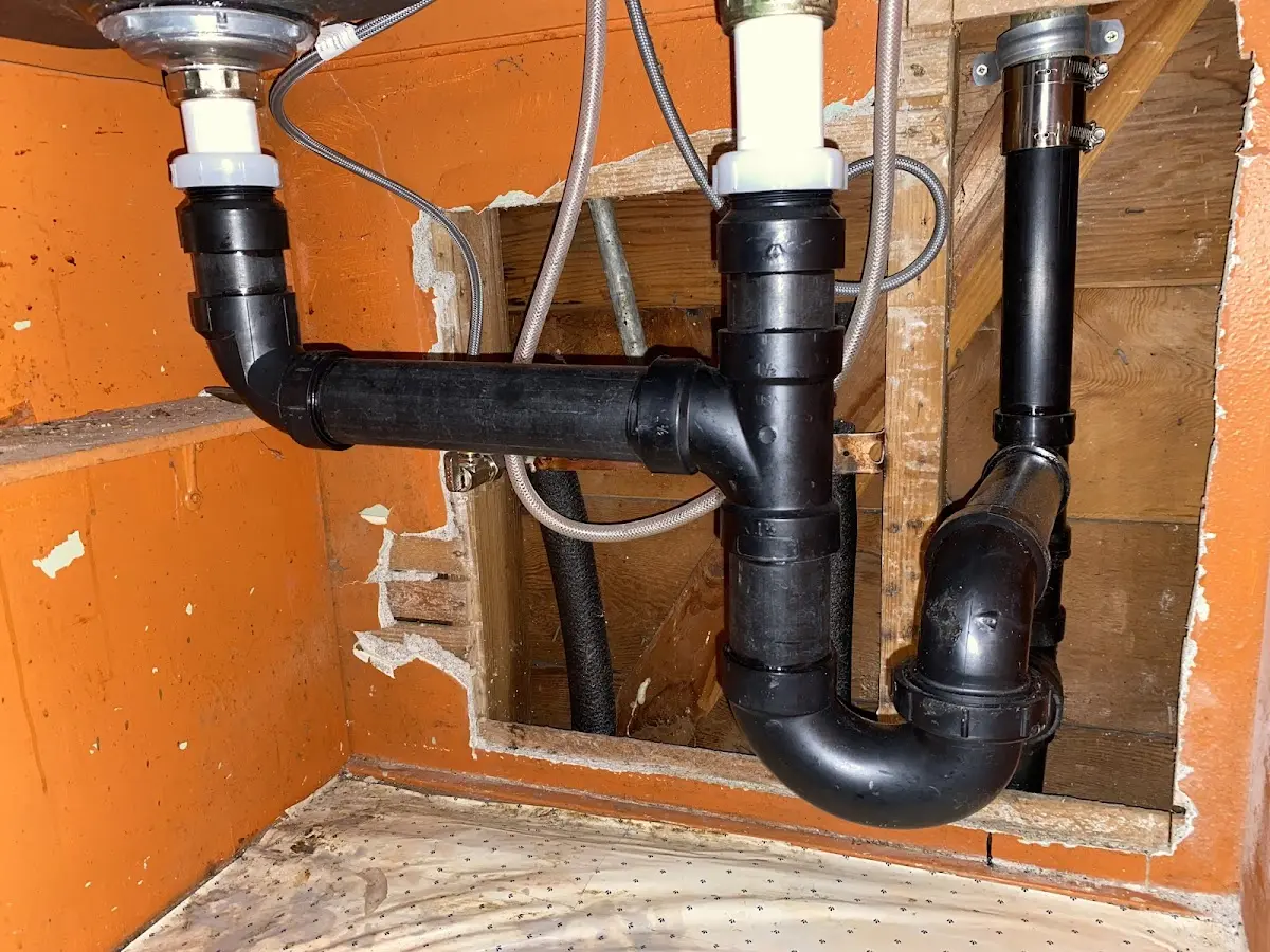 Professional Garbage Disposal Repair equipment and tools on the job in Rochester